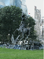 Bottom right picture is a statue that is seen in the center of the lawn on the UN.