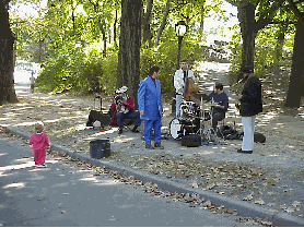 Some of the best things in life are free!  In the picture to the right you see a band playing in Central Park.  They have a large audience not seen here, but you do see one little angel that really got into their sounds.