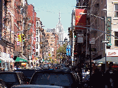 Top right picture is Mulberry Street and in the distance you can see the Empire State Building.  On nice days the waiters stand outside on the sidewalks smiling and inviting you to come in and dine.  