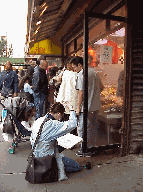 Top right picture you see an artist painting the scene in a busy fish market on Canal Street.  (a smelly job)