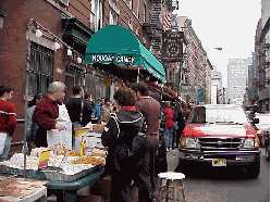 Top right picture you see a man selling Italian candy on the sidewalk. The streets are lined with great Italian restaurants, food stores and souvenir shops.