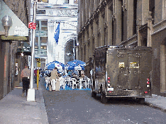 Top right picture you see an instant dining room on Wall Street.  Zoom in and you'll see that tables were set up in the middle of this narrow street.