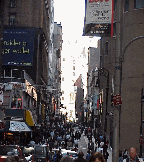 Center right photo is Nassau Street a few blocks from Wall Street where people spend their money shopping.