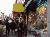 Center right you see a jewelry store on Canal Street.  In Chinatown you can find wonderful Chinese charms and jewelry that you won't find anywhere else.