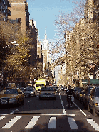 Center you see the view on Fifth Avenue when you stand directly in front of the arches.  In the far distance you can see the Empire State Building.