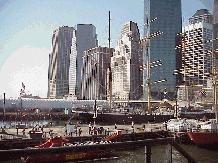 Top left picture is the Brooklyn Bridge with the Municipal Building in the distance. Top right picture is a view of the skyline of downtown Manhattan as seen from the pier at South Street Seaport.