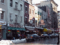 Bottom right picture you see some of the stores that line the streets of Little Italy. You'll find plenty of places to buy souvenirs.  People come to Little Italy to dine dressed in jeans or in full length mink.  Just come here hungry folks.