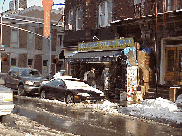 Center right picture is Thompson Street News stand in the snow.  Most streets have news stands like this one and a deli on most corners.