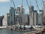 Top left picture is a memorial to the  Merchant  Mariners at Battery Park.  In the far distance you  can see the Statue of Liberty. Top right picture was taken from the Brooklyn Bridge.  You see the piers of downtown's South Street Seaport.