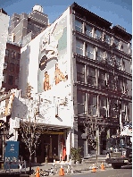 Bottom right you see a restaurant on West Broadway.  In nice weather diners enjoy the view while they dine on the rooftop of the restaurant.  Before air conditioning, rooftop business was booming.