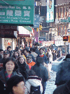 Center right picture you see a sidewalk on Canal Street.  Chinatown is always busy.  Since so many stores and vendors sell on the sidewalks, it gets very crowded.