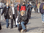 Tele-marketer?  Top right photo a lady takes a seat on 6th Avenue in Greenwich Village while she waits for a cab and talks on her cell phone.