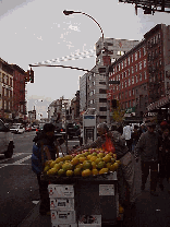 Top left picture you see a vendor selling fruit on the sidewalk in Chinatown.