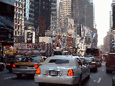 Top right picture you see a limousine making its way through Times Square.  You'll find getting around easy in NY with plenty of taxicabs, buses, subways, rental cars and of course limos are available for a memorable evening in the city.