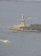 Top left picture is an aerial view of the Statue of Liberty as seen from the top of the Twin Towers.