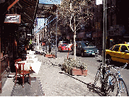 Center right you see a table on the sidewalk of MacDougal Street.  In nice weather if you are lucky enough to get an outdoor table, you'll find Greenwich Village is the best people watching spot in the world.