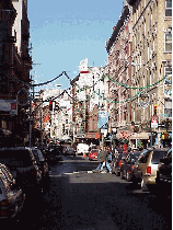 Bottom right picture you see a long shot of Little Italy and Mulberry Street.  The area of Little Italy is very small and its borders are so close to Chinatown that you'll see Chinese stores next door to Italian cheese stops. This makes it even more fun.