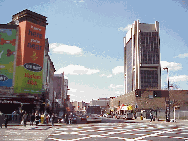 Top right picture the tall building to the right is the Adam Clayton Powell Building.