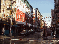 Bottom right picture you see a street in Little Italy with colorful buildings and decorations.