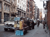 Top left picture you see someone selling scarves on the streets of Soho.  You'll enjoy viewing the fresh designs of young artists as they sell their creations on the sidewalks of Soho.