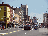 Top left picture is 125th Street in Harlem.  The tall building is where former President Clinton has his offices.  This is on the main drag in Harlem. Top right picture is another look at 125th Street.