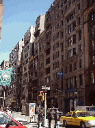 Top left picture you see Broadway near East 3rd Street.  In this area you will find a lot of music stores and shopping for jeans, etc.