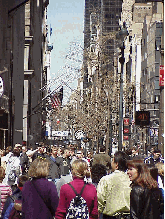 Top right photo you see the crowded sidewalks of Fifth Avenue. Where is everybody going?