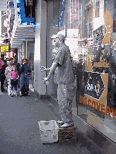 Top right photo you see a mime performing for a captive audience in Times Square.