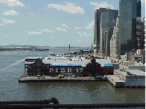 Bottom right picture you see Pier 17 and South Street Seaport as seen from the Brooklyn Bridge.  The walk over the bridge is very safe.  You'll see parents with strollers and people biking and skating.  Many people that live in Brooklyn walk to work.