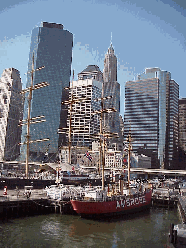 Top right picture you see the historic ships that are a part of the South Street Seaport Museum.  You see the skyline of the city in the background.