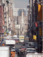 Bottom right is a picture looking up Broadway from Canal Street.  In the distance you see Grace Episcopal Church  which was built in 1843 by the same designer that built St. Patrick's Cathedral.  Broadway takes a turn there. The church owns the land.