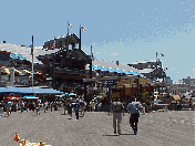 Top right picture you see South Street Seaport.  Here you can shop in a large mall on the pier or roam the South Street Seaport Museum.