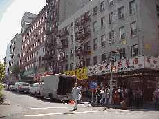 Center right picture you see more stores on Grand Street.  You'll pass by stores selling fruits, herbs, fans, teas, and souvenirs.