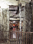 They have taken advantage of the natural characteristics of the old building and turned a drain pipe into an artistic waterfall in the center of the hallway.