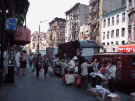 Bottom right picture you see shoppers on Grand Street in Chinatown.