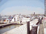 Center right photo you see a view of the boats docked at Chelsea Piers.  In the far distance you see the skyline of New Jersey.