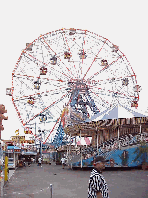 Top right picture you see the Wonder wheel, a giant ferris wheel at Coney Island.  The first ferris wheel was built by George W. G. Ferris for the Chicago World's Fair in 1893.