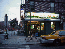 Bottom right picture you see a pizza parlor at twilight.