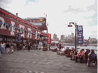 Bottom right you see Pier 17 at South Street Seaport.  Inside of the pier you'll find a huge mall with restaurants and stores.  During the summer outside you'll find free entertainment.