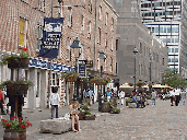 Top right photo you see South Street Seaport Museum at South Street Seaport. You'll find shops and stores here along the cobblestone street.