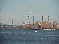 Center right picture is looking south and you see the Williamsburg Bridge and the smoke stacks of the city.