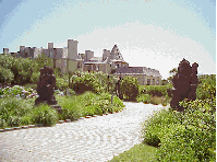 Top right you see a mansion on the beach in the Hamptons.  The sculptures that line the driveway look as if they came from the Met.  All along the drive on the beach you see homes like this with private beachfronts of clean white sand.