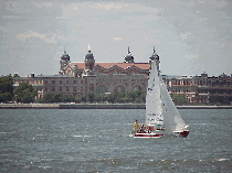 Top right picture you see Ellis Island as seen from the esplanade at Battery Park. Top left picture you see the southern tip of NYC with the skyline and the World Trade Towers to the right, the Jewish Heritage Museum to the left.