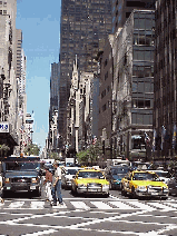 Top right picture you see a distant shot of Fifth Avenue.  All along this street you'll see famous stores with windows that invite you in to spend big bucks.