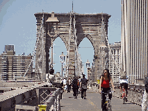 Center right picture you see people walking and biking across the Brooklyn Bridge.  It's a safe trip and it will take you about 20 minutes to walk from Manhattan to Brooklyn Heights.