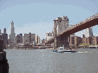 When you take a walk across the Brooklyn Bridge you'll be rewarded with great views of the skyline of NYC along with some exercise. Top left picture you see the Brooklyn Bridge.  To the far left you see the Woolworth Building which is one of NY's oldest.