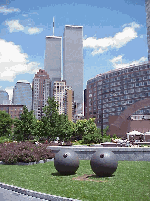 Top right you see the southernmost tip of the island with the World Trade Towers in the distance.  Towards the front of the picture you see a pair of sculptures.  Everyone has something to say about this artwork.