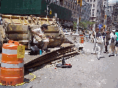 Top right picture you see a guitar player has found himself a bandstand on top of construction equipment at Union Square Park.