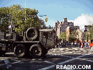 If you are one of our regular readers you already know our daily photo tours are upbeat and happy.  We never thought we would be photographing pictures such as the ones you see top left as tanks move down Houston Street.