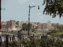 Bottom right picture you see a distant view of the Bronx.  The Harlem River divides Harlem and the Bronx.